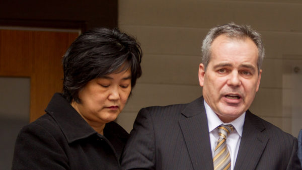 Calgary Police Service Insp. Doug de Grood is supported by his wife Susan as he reads a prepared statement to media next to defence lawyer Allan Fay outside of the Fay Snukal and Associates office in Calgary, Alta., on Thursday, April 17, 2014. Doug and Susan's son Matthew de Grood is charged with five counts of first degree murder in the stabbing deaths of five young people at a house party early on April 15. Lyle Aspinall/Calgary Sun/QMI Agency