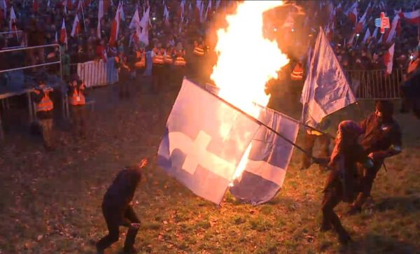 protesters_burn_facebook_flags